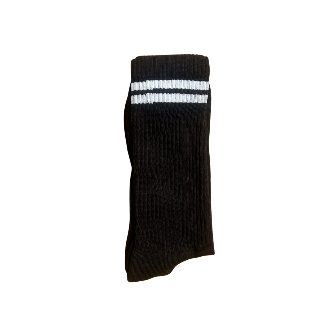 A single black ribbed crew sock with two white horizontal stripes near the cuff.