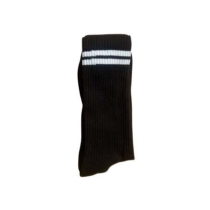 A single black ribbed crew sock with two white horizontal stripes near the cuff.